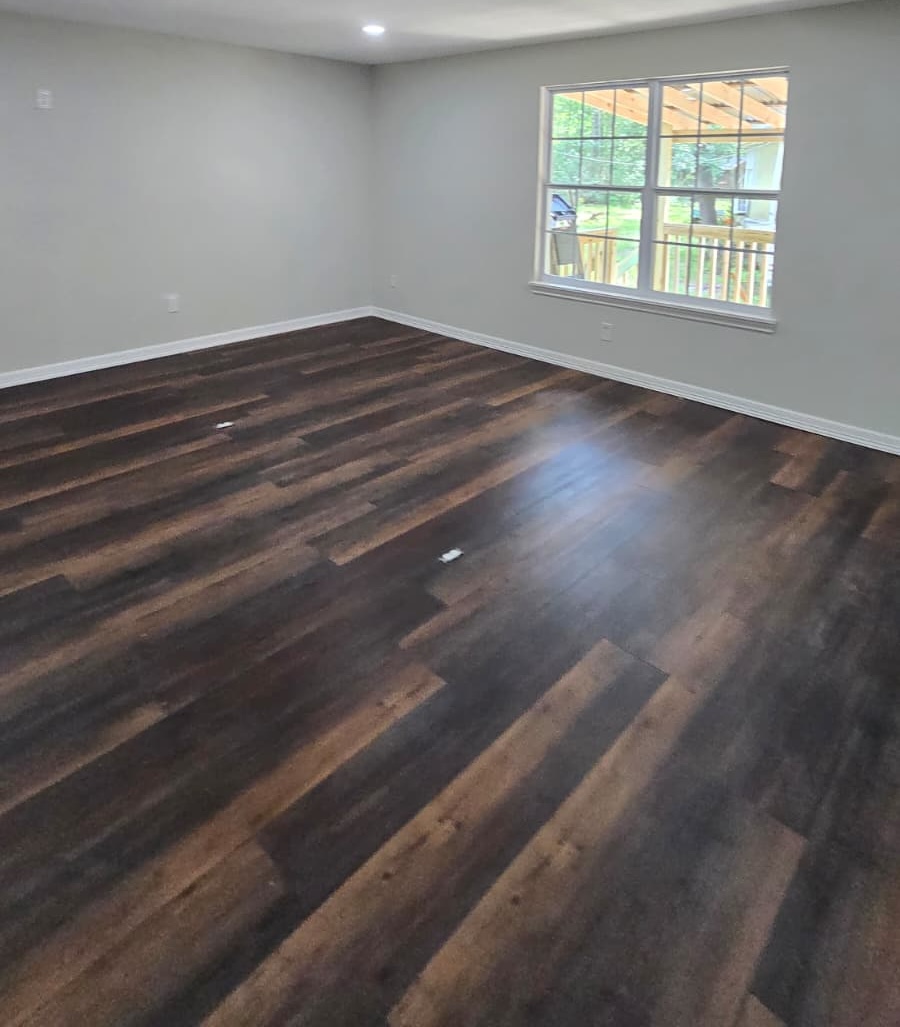 hardwood flooring contractors installing hardwood planks